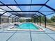 Inviting screened-in pool with lounge chairs is perfect for relaxing on sunny afternoons at 25068 Harborview Rd # 1A, Punta Gorda, FL 33980