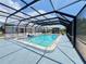 Beautiful screened-in pool area with ample seating for outdoor entertaining at 25068 Harborview Rd # 1A, Punta Gorda, FL 33980