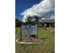 Community welcome sign set in the beautiful Shararmere Woods 55+ community at 25068 Harborview Rd # 1A, Punta Gorda, FL 33980