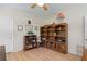 Home office with ample built-in shelving and wood floors at 2507 Via Veneto Dr, Punta Gorda, FL 33950