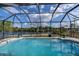 Refreshing screened pool with canal views at 2578 Broad Ranch Dr, Port Charlotte, FL 33948