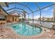 Relaxing kidney-shaped pool with screened enclosure, offering water views at 3322 Sandpiper Dr, Punta Gorda, FL 33950