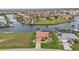 An aerial view of a waterfront home, with a canal and other houses visible at 3322 Sandpiper Dr, Punta Gorda, FL 33950