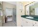 Bathroom features vanity with solid surface counter and glass-enclosed shower at 3646 Madagascar Ave, North Port, FL 34286