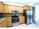Bright kitchen features stainless steel appliances, ample cabinetry, and tile flooring at 3646 Madagascar Ave, North Port, FL 34286