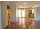 Bright and open living space with tile flooring and access to the kitchen at 3646 Madagascar Ave, North Port, FL 34286