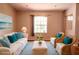 Bright living room with a neutral color scheme, comfortable seating, and ample natural light at 3646 Madagascar Ave, North Port, FL 34286