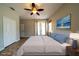 Spacious main bedroom with ceiling fan, tile floors, and a private patio at 3646 Madagascar Ave, North Port, FL 34286