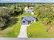Aerial view of a single-story house with solar panels and a large yard at 4340 Adolph Ave, North Port, FL 34288