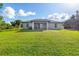 Large backyard with lush grass and a view of the house at 4340 Adolph Ave, North Port, FL 34288