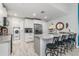 Updated kitchen featuring stainless steel appliances, granite countertops, and island with seating at 4340 Adolph Ave, North Port, FL 34288