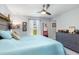 Spacious bedroom with large bed, dresser, and window overlooking backyard at 4340 Adolph Ave, North Port, FL 34288
