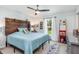 Bright bedroom with a unique wooden headboard and access to backyard views at 4340 Adolph Ave, North Port, FL 34288