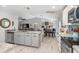 Open concept kitchen with stainless steel appliances and granite countertops at 4340 Adolph Ave, North Port, FL 34288