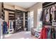 Spacious walk-in closet with custom shelving and rods at 681 Macedonia Dr, Punta Gorda, FL 33950