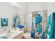 Clean bathroom with single sink, shower, and nautical themed decor at 10191 Arrowhead Dr, Punta Gorda, FL 33955