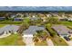 Aerial view of a single-Gathering home with a large backyard and surrounding neighborhood at 15 White Marsh Ln, Rotonda West, FL 33947