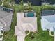 An overhead view of a single-Gathering home with a pool and a metal roof at 15460 Longview Rd, Port Charlotte, FL 33981
