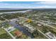 Aerial view of property, highlighting canal-front location and neighborhood at 15460 Longview Rd, Port Charlotte, FL 33981
