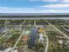 Aerial view showing home's location on canal with water access at 15460 Longview Rd, Port Charlotte, FL 33981