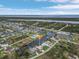 Wide aerial view of the property's location on the canal and neighborhood at 15460 Longview Rd, Port Charlotte, FL 33981