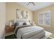 Well-lit bedroom featuring a queen bed and wood nightstands at 15460 Longview Rd, Port Charlotte, FL 33981