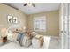 Cozy bedroom with a queen-size bed and ample natural light at 15460 Longview Rd, Port Charlotte, FL 33981