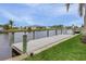 Private boat dock with green posts and a spacious wooden platform at 15460 Longview Rd, Port Charlotte, FL 33981
