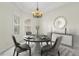 Elegant dining room with a chandelier and modern decor at 15460 Longview Rd, Port Charlotte, FL 33981