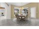 Bright dining room with table and chairs, offering a view of the water at 15460 Longview Rd, Port Charlotte, FL 33981