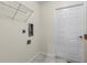 Functional laundry room with shelving, hookups, and a built-in counter at 15460 Longview Rd, Port Charlotte, FL 33981