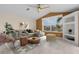 Spacious living room featuring a comfortable sectional sofa and large windows at 15460 Longview Rd, Port Charlotte, FL 33981