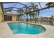 Inviting screened pool area with canal views and a relaxing atmosphere at 15460 Longview Rd, Port Charlotte, FL 33981