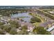 Community overview showcasing lake, buildings, and landscaping at 1568 Red Oak Ln, Port Charlotte, FL 33948