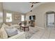 Spacious living room with sectional sofa and access to other rooms at 167 Mocha Ct, Punta Gorda, FL 33983