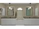 Double vanity bathroom with modern lighting and a window at 167 Mocha Ct, Punta Gorda, FL 33983