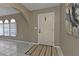 Bright entryway with beige walls, tile floor, and arched doorway at 167 Mocha Ct, Punta Gorda, FL 33983