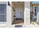 Inviting front entrance with white door, small table, and potted plants at 167 Mocha Ct, Punta Gorda, FL 33983