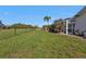Large grassy backyard with a fenced perimeter at 167 Mocha Ct, Punta Gorda, FL 33983