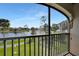 Scenic balcony view overlooking the lake and lush landscaping at 23465 Harborview Rd # 1028, Punta Gorda, FL 33980