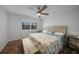 Spacious bedroom with a large bed and wood floors at 23465 Harborview Rd # 1028, Punta Gorda, FL 33980