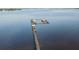 Aerial view of a dock with several boat slips and a covered area at 23465 Harborview Rd # 1028, Punta Gorda, FL 33980