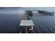 Aerial view showing a long dock with boat slips and a Tiki Bar at 23465 Harborview Rd # 1028, Punta Gorda, FL 33980