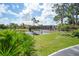 Charming footbridge over a serene lake with lush landscaping at 23465 Harborview Rd # 1028, Punta Gorda, FL 33980