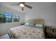 Bright bedroom with a king-size bed and coastal-themed bedding at 23465 Harborview Rd # 1028, Punta Gorda, FL 33980