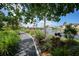 Scenic walking path alongside a peaceful lake at 23465 Harborview Rd # 1028, Punta Gorda, FL 33980