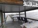 Covered tiki bar on the waterfront with seating and views at 23465 Harborview Rd # 1028, Punta Gorda, FL 33980