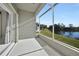 Screened porch overlooking a tranquil lake at 24229 Westgate Blvd, Punta Gorda, FL 33980