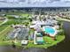 Community pool and tennis courts near golf course and lake at 24229 Westgate Blvd, Punta Gorda, FL 33980