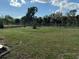 Open grassy backyard with partial fence at 3245 Normandy Dr, Port Charlotte, FL 33952